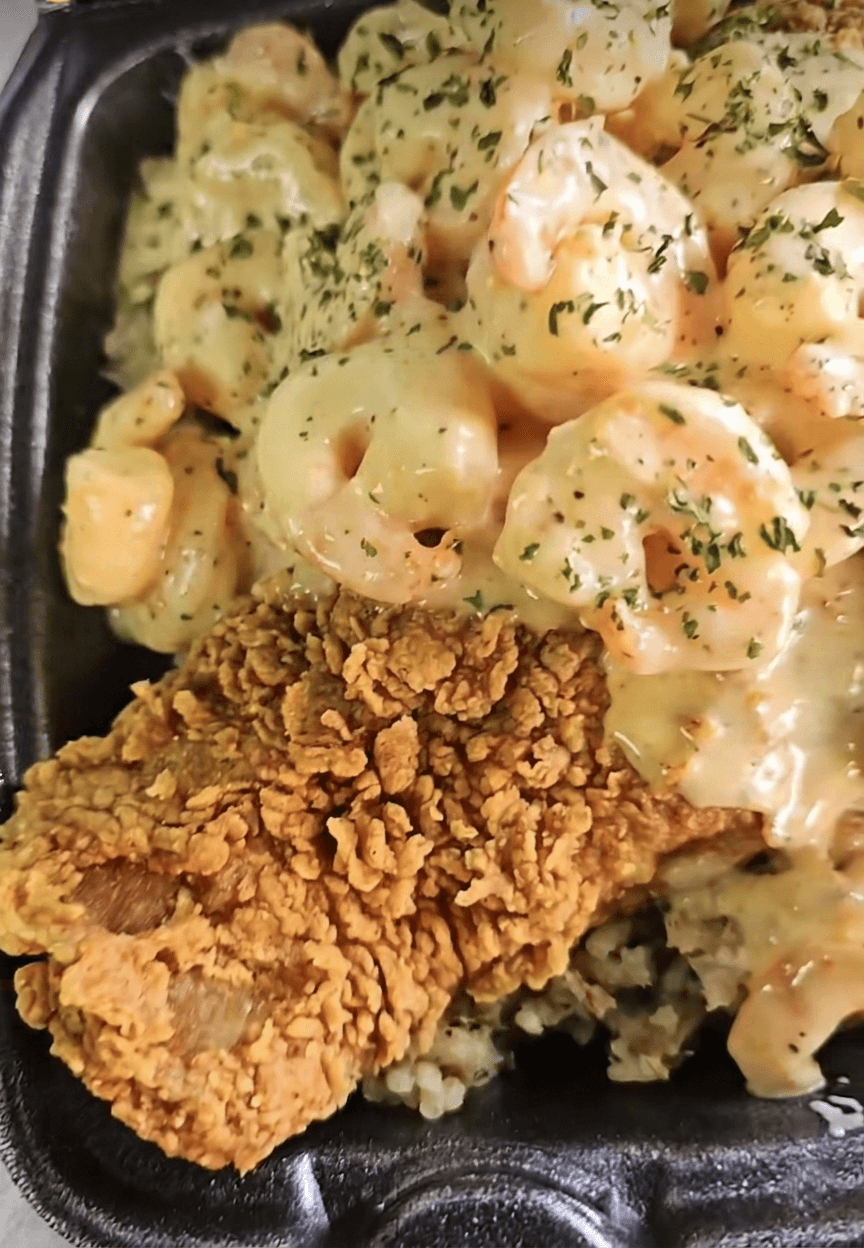 Moe's Bowl — creamy shrimp and crawfish sauce over fried chicken and rice — Lil Moe's Potato Trap Houston